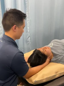 Burlington physiotherapist providing neck treatment to patient for stress relief and mental health support
