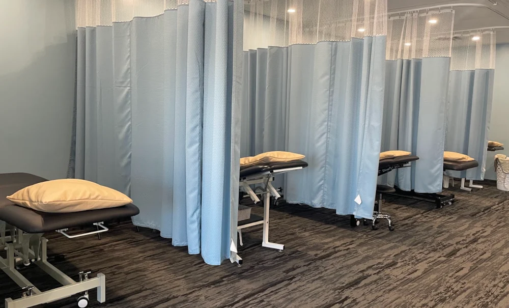 Burlington physiotherapy clinic treatment room with therapy tables for rehabilitation and mental wellness